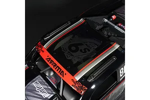 Close-up of ARRMA Mojave 6S EXB RC truck roof showing red stripe, ARRMA branding, and 6S graphic on a black background.