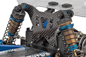Close-up of carbon fiber rear shock tower and aluminum shocks on Team Associated RC car