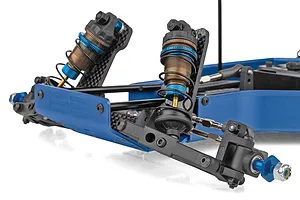 Close-up studio shot of the front suspension, blue aluminum chassis, and threaded shocks of a Team Associated RC car.