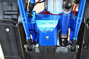 Installed blue aluminium lower spur gear case cover featuring the GPM logo on an RC chassis
