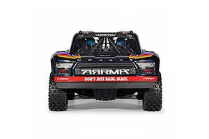 Front view of the ARRMA Mojave 6S RC short course truck in blue, showcasing driver figures and front grille branding.