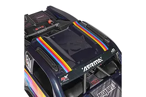 Top down close up of the blue ARRMA Mojave 6S RC short course truck body, showcasing multicolor stripes, branding, and scale interior details.