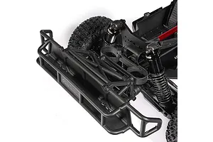 Close-up studio view of the front bumper, shock absorbers, and chassis structure of the ARRMA MOJAVE 6S RC short course truck.