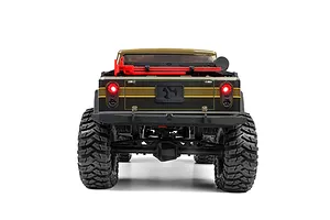 Rear view of the green Axial SCX10 III Motobilt Jeep JT Gladiator RC rock crawler showing lit tail lights and rear suspension.