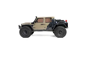 Studio side profile shot of the Axial SCX10 III Motobilt Valyrian Jeep JT Gladiator RC crawler in tan on a white background.