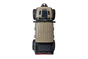 Top-down studio view of the Axial SCX10 III Motobilt Valyrian Jeep JT Gladiator RC crawler in tan, showing the roof and truck bed layout.