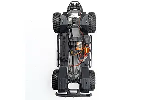 Top-down studio view of an RC crawler chassis showing internal components, motor, gears, and tires on a white background.