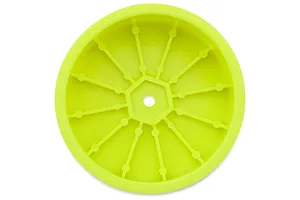 A single yellow RC buggy dish rim viewed from the inside, showing the central hex mount and reinforcing ribs against a plain white background.