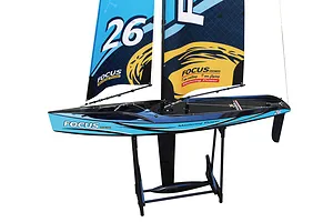 Joysway Focus V3 RC sailboat in blue and black resting on a black display stand against a white background.