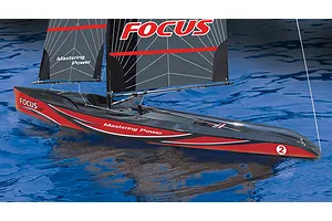 Joysway Focus V3 RC sailboat with black and red hull and sails on blue water