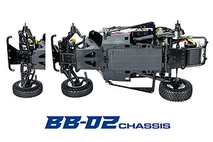 Studio shot of the Tamiya BB-02 RC car chassis from the bottom, showing suspension, wheels, and layout with BB-02 CHASSIS text below.