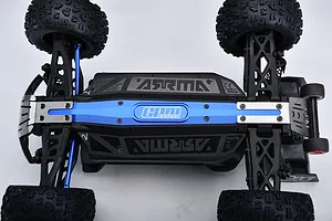 Underside view of an RC car installed with GPM blue aluminium chassis brace and skid plate upgrade parts.