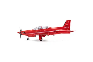 Studio side profile shot of the red E-Flite Pilatus PC-21 RC plane standing on its landing gear against a white background.