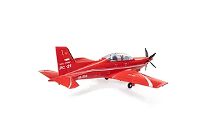 Studio shot of a red E-Flite Pilatus PC-21 RC plane viewed from the rear three-quarters against a white background.