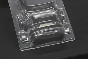 Unpainted clear polycarbonate RC car body accessory parts on a dark background.