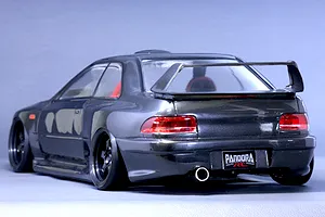 Rear three-quarter view of a painted dark grey Subaru Impreza 22B STi RC body shell on a grey background.