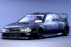 Painted dark grey Pandora RC Subaru Impreza 22B STi body shell mounted on a radio control drift car chassis against a plain background.
