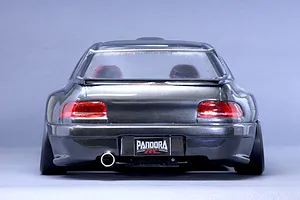Rear view of a dark grey Subaru Impreza RC drift car body shell featuring a Pandora RC license plate and single exhaust tip.