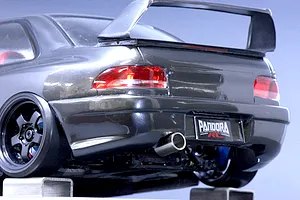Rear close-up view of the Pandora RC Subaru Impreza 22B STi body shell, showcasing the rear wing, exhaust tip, and licence plate.