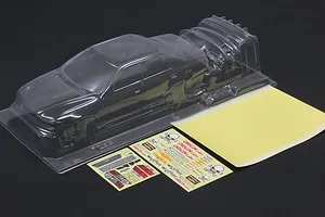 Clear unpainted polycarbonate RC car body shell with separate decal sheets and mask sheet on a dark background.