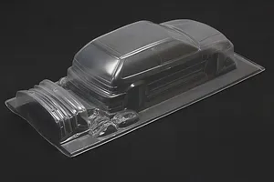 Unpainted clear polycarbonate 1/10 scale Honda Civic EF9 RC body shell on a dark background.