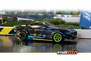 HPI Stage-D10 Ford Mustang GT RC drift car driving on an indoor track with neon green wheels and sponsor decals.