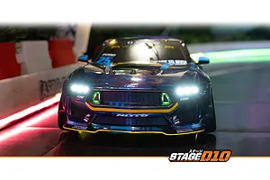 Front view of the HPI Stage-D10 Ford Mustang GT RC drift car with illuminated headlights on a track.