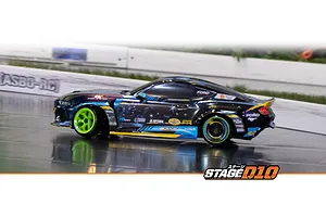 Action shot of the HPI Stage-D10 Ford Mustang GT RC drift car drifting on an indoor RC track with bright green wheels.