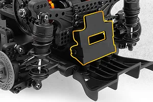 Close-up of the rear suspension and chassis components of an RC drift car with an orange highlighted mounting plate.