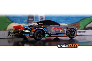 Side-rear profile view of an HPI Stage-D10 Ford Mustang GT Spec-5 FD RC drift car on an indoor track.