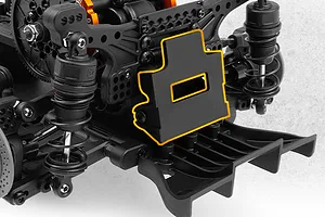 Close-up of the rear chassis assembly of an RC drift car showing suspension shocks, shock tower, and rear diffuser with a highlighted part.