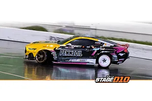 HPI Stage-D10 Ford Mustang GT RC drift car in action on an indoor track, featuring a yellow and black Pennzoil livery.