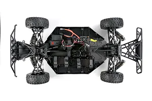 Top-down view of the Rovan ELT320S V2 RC short course truck chassis, showing electronics, suspension, and tires on a white background.
