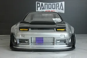 Front view of an RC drift car body installed with a detailed front-mounted intercooler accessory behind the bumper opening.