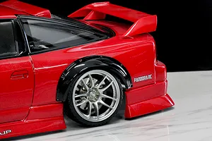 Close-up of a red RC car body featuring a black over fender set installed over the rear wheel, showcasing Pandora RC branding.