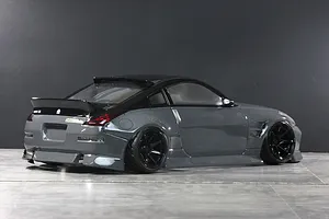 Rear three-quarter view of a gloss grey RC drift car body styled as a Nissan 350Z with black roof, spoiler, and wheels.