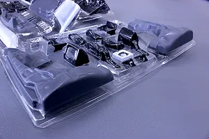 Pandora RC general purpose interior parts set in a clear plastic vacuum-formed blister pack on a grey surface.