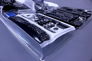Pandora RC general purpose interior set inside a clear plastic molding sheet on a grey surface.
