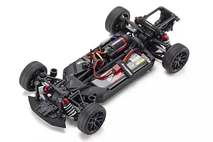 Top-down studio view of the Kyosho Fazer Mk2 RC car chassis showing internal electronics and suspension.