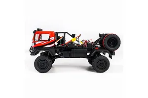 Side view of the HobbyPlus DKR-4 Fortis 4X4 RC desert rally truck in red and black, showing the cabin and open rear cage with a spare tire.