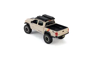 Rear-high angle studio shot of the brown Axial SCX30 Toyota Tacoma RC rock crawler truck on a white background.