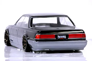 Rear three-quarter view of a painted black and silver RC drift car body shell with Pandora RC branding on the license plate, set against a plain white background.