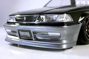 Close-up front view of the Pandora RC Toyota Mark 2 JZX81 body shell in black and silver on a white background.