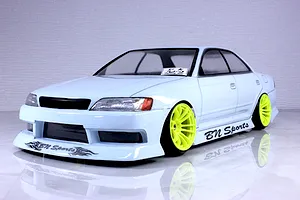 Painted RC drift car body of a Toyota Mark II JZX90 with BN Sports styling, bright yellow wheels, and decals.