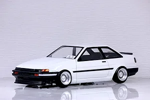 Studio shot of a Pandora RC Toyota AE86 Sprinter Trueno 2-door body shell painted white with black trim and custom wheels.