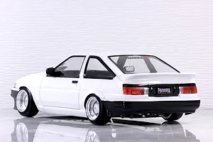 Rear three-quarter view of a white Toyota AE86 Trueno 3-door RC drift car body shell with deep dish wheels.