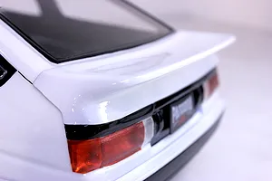 Close-up of the rear spoiler and taillight section of a white Pandora RC Toyota AE86 Sprinter Trueno body shell.