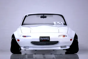Front view of a white Mazda Eunos Roadster NA RC drift car body shell with wide wheels and Pandora RC branding.