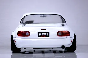 Rear view of a white Pandora RC Mazda Eunos Roadster body shell featuring tail lights, exhaust tip, and Pandora RC branding.