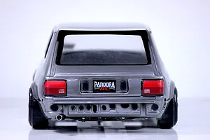 Rear view of the painted Pandora RC Toyota Starlet KP61 late model RC body shell in metallic grey with a Pandora RC license plate and exhaust tip.